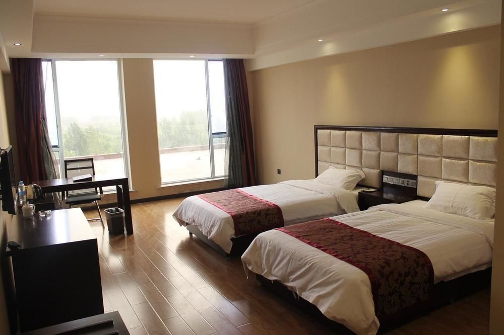 Weishi International Hotel Qing Zhou Esterno foto